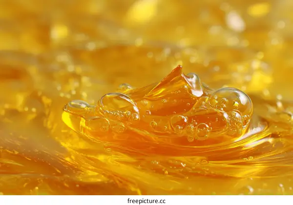 Close-up view of golden liquid with bubbles