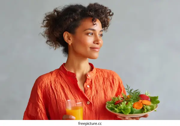 Woman Holding Healthy Salad and Juice