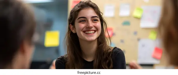 Smiling Woman In a Meeting With Colleagues