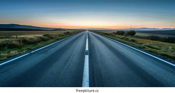 Empty Asphalt Road at Sunset