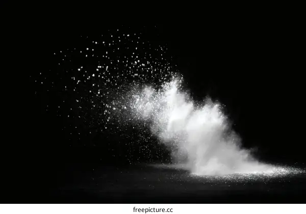 Abstract White Powder Explosion on Black Background