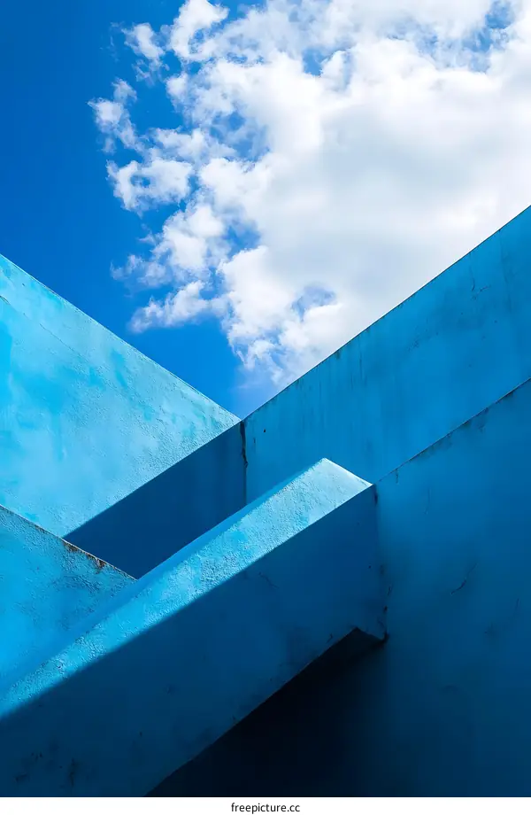 Abstract Blue Concrete Structure with Clouds