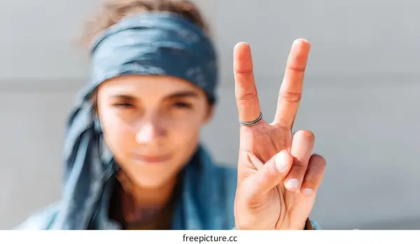 Peace Sign by a Woman with a Headband