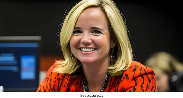 Portrait of Smiling Woman in Red Blouse