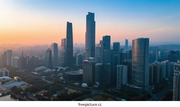 Aerial View of Modern City Skyline at Sunrise