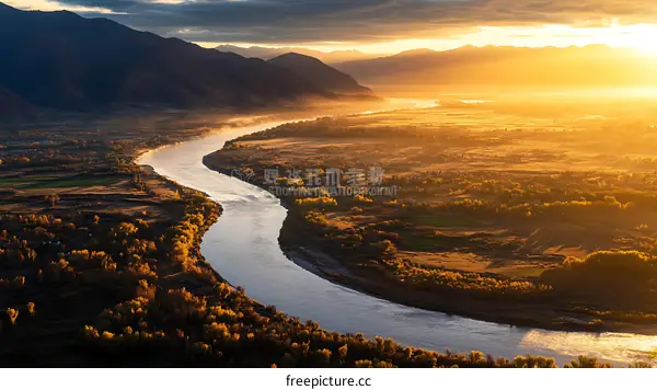 Autumn Sunrise Over a Winding River Valley