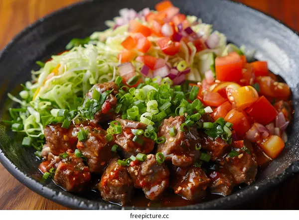 Beef cubes with salad on a plate