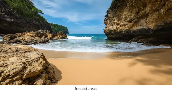 Hidden Beach Cove with Lush Green Cliffs and Turquoise Water