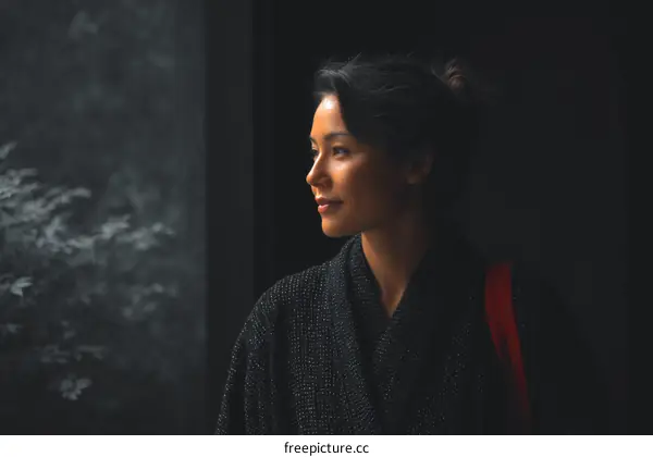 Asian Woman in Traditional Outfit, Thoughtful Portrait