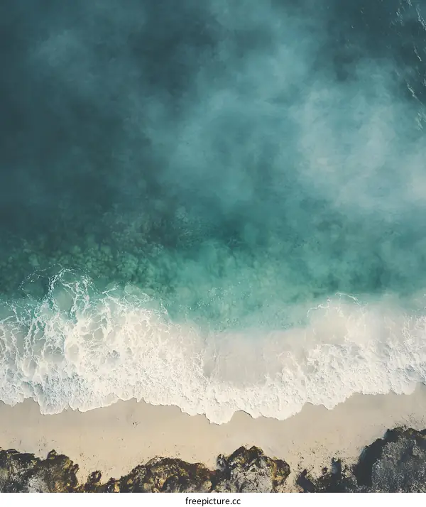 Aerial View of Beach with Foamy Waves