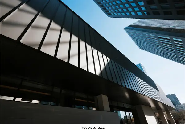 Modern Architectural Design with Glass Facade in Urban Area