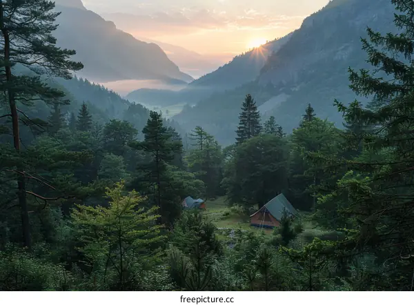 A serene valley with two tents and mountains in the distance