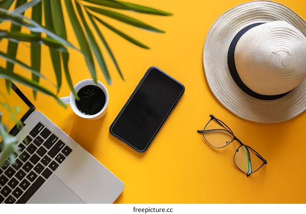 Summer Flatlay With Laptop, Coffee, Smartphone, Hat, and Glasses