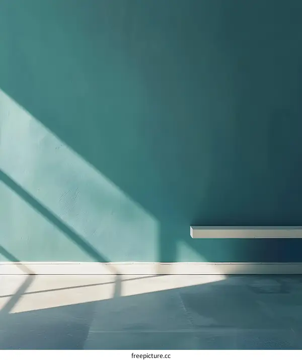 Sunlight Through Window In Empty Room With Teal Wall