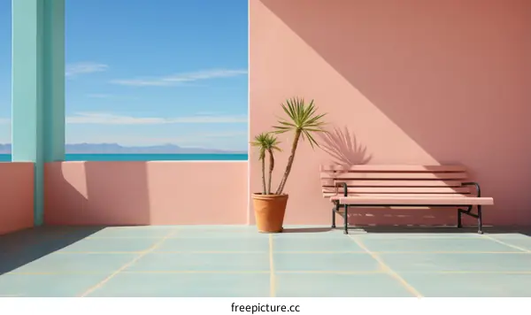 Palm tree in front of pink wall with blue ocean view
