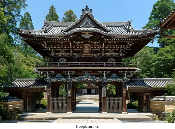 Traditional Japanese Temple Gate Architecture With Elaborate Carvings And Decorations