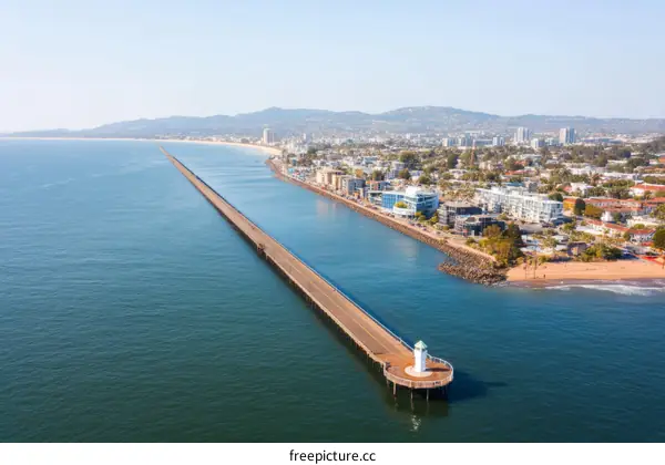 Coastal Pier with Cityscape View