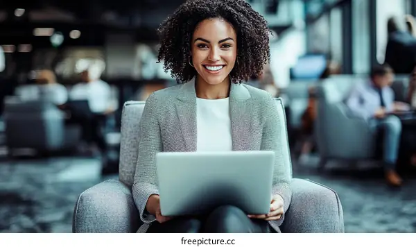 Businesswoman Working on Laptop in Modern Office