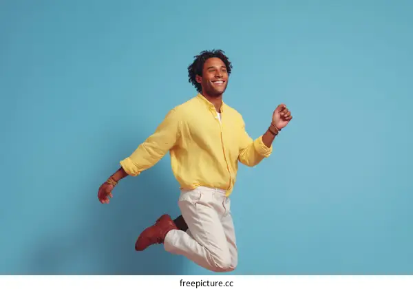 Happy Black Man in a Yellow Jumpsuit