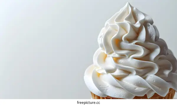 Close-up of a vanilla soft serve ice cream cone