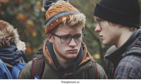 Two Young Men Having a Conversation in the Woods