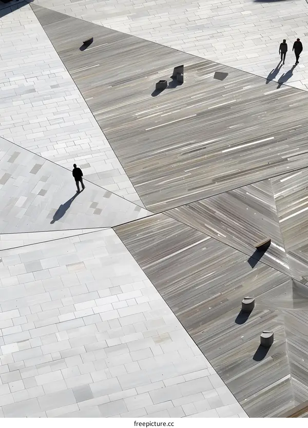 Aerial View of People Walking on a Geometric Patterned Plaza