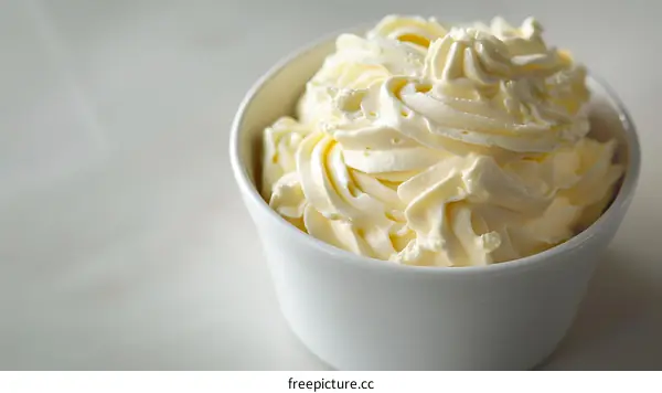 Close Up of Whipped Cream in a White Bowl