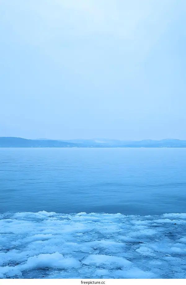 Frozen Lake with Mountains in Background