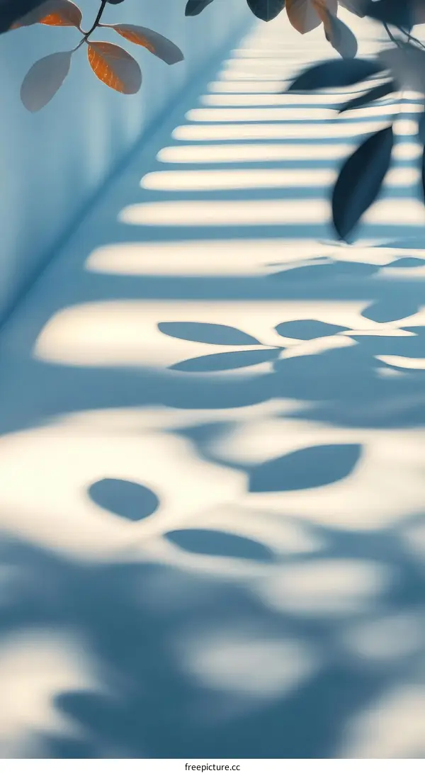 Shadow Play of Leaves on a Light Blue Surface