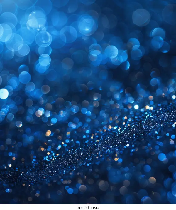Blue abstract background with blurred bokeh lights