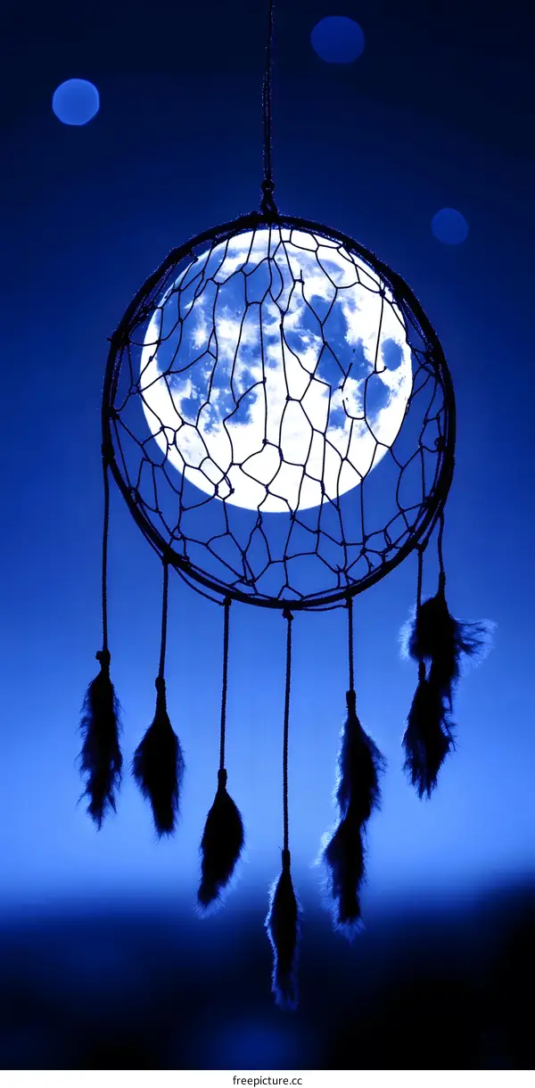 Dreamcatcher With Full Moon In The Night Sky