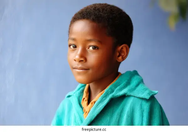 Portrait of a Child African Boy in Teal
