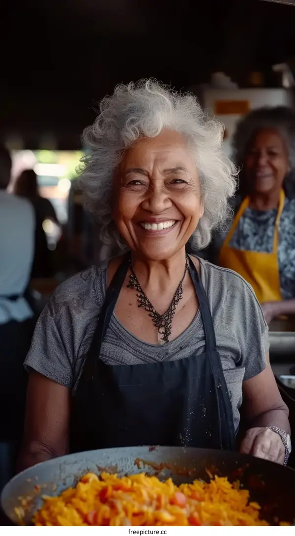 Portrait of a smiling elderly woman with gray hair and wrinkles
