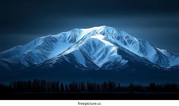 Majestic Mountain Peak Illuminated by Dawn Light
