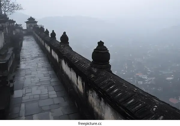 Stone Pathway and Cityscape in the Fog