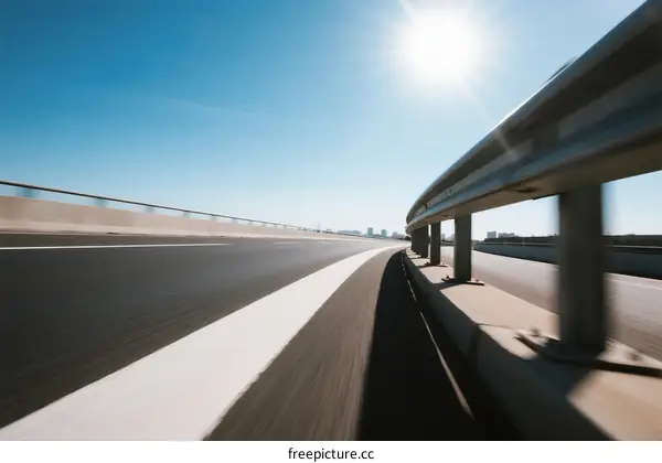 Blurred motion on a highway under a bright sun