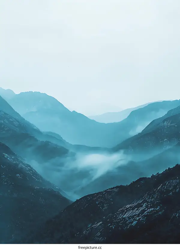 Mountain Ranges With Fog in Blue Tones