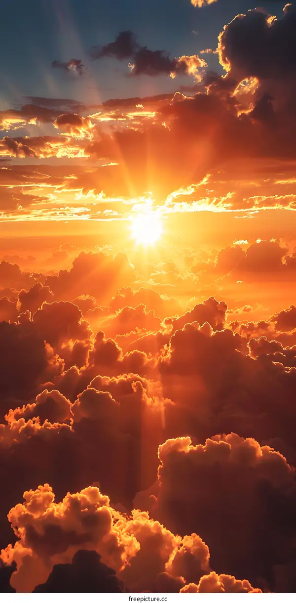 Sunset over the clouds from above