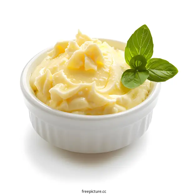 Close-up of butter in bowl with basil