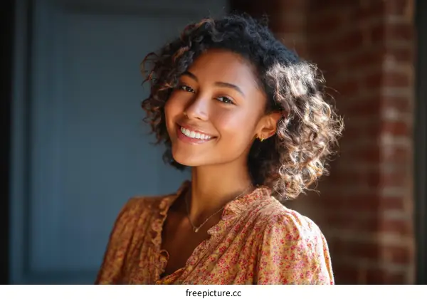 Smiling Young Woman with Curly Hair Portrait