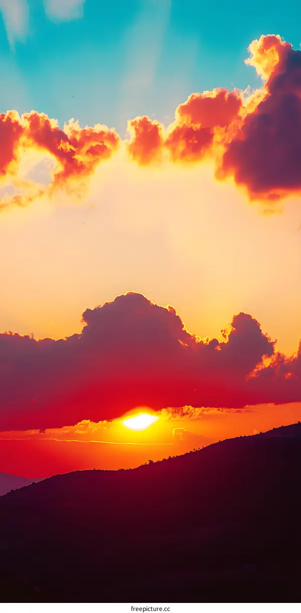 Orange and Blue Sunset over Mountain Silhouette
