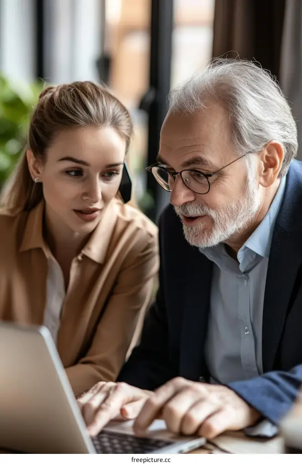 Business Colleagues Working on Laptop in Cafe