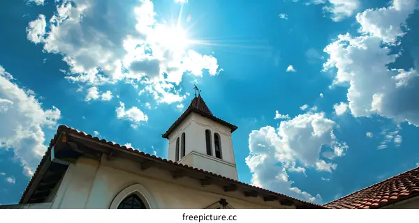 Church Tower with Blue Sky and Sun