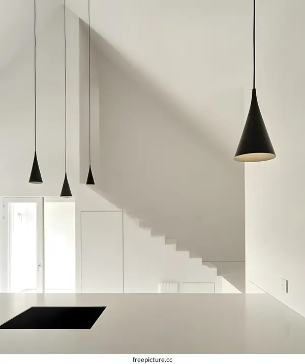 Minimalist White Interior Design with Black Pendant Lights and Stairs