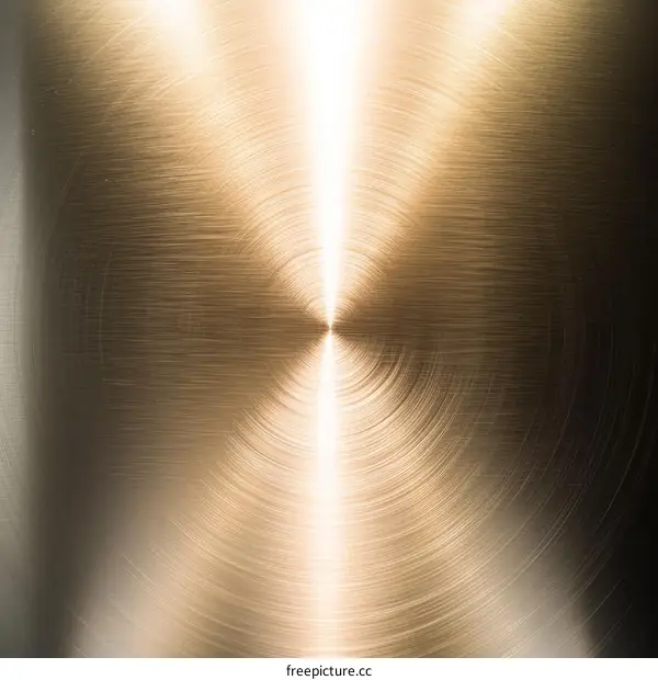 Golden metal texture with a shiny spot in the middle