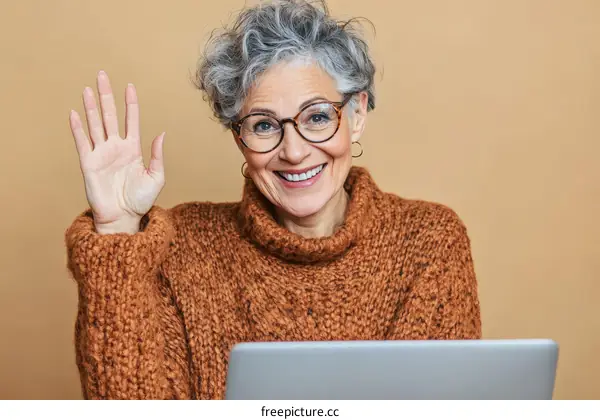 Friendly Senior Woman Waving Hello