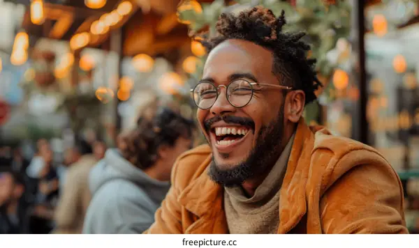 Laughing man with glasses and beard