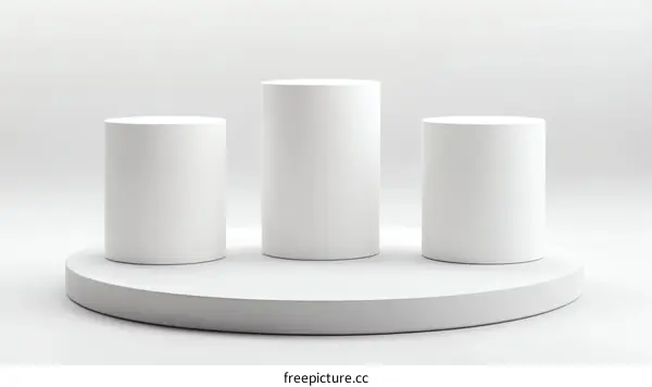 Three White Cylindrical Display Stands