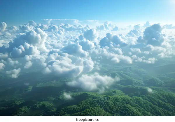 Aerial View of Cloudscape Over Lush Mountains