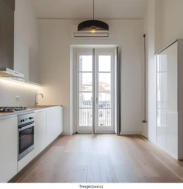 Minimalist Kitchen Interior Design with White Cabinets and Modern Pendant Light